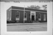 215 N WALNUT ST, a Colonial Revival/Georgian Revival post office, built in Reedsburg, Wisconsin in 1937.