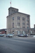713 S MAIN ST, a Romanesque Revival brewery/distillery/winery, built in Shawano, Wisconsin in 1914.