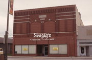 214 S MAIN ST, a Commercial Vernacular large retail building, built in Shawano, Wisconsin in 1903.