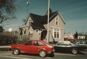 137 E 3RD ST, a Cross Gabled small office building, built in New Richmond, Wisconsin in 1883.