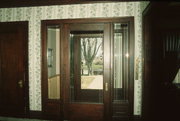 112 S DAKOTA AVE, a American Foursquare house, built in New Richmond, Wisconsin in 1912.