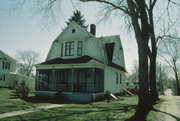 326 W 2ND ST, a Dutch Colonial Revival house, built in New Richmond, Wisconsin in 1900.