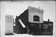212 LOCUST, a Italianate small retail building, built in Hudson, Wisconsin in 1895.
