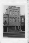 160 E MAIN ST, a Italianate social recreational/fraternal hall, built in Stoughton, Wisconsin in 1869.