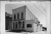112 WALNUT ST, a Commercial Vernacular large retail building, built in Hudson, Wisconsin in 1857.