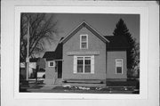 137 E 3RD ST, a Cross Gabled small office building, built in New Richmond, Wisconsin in 1883.