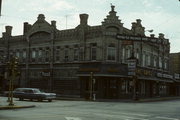 225-227 E MILL ST, a German Renaissance Revival retail building, built in Plymouth, Wisconsin in 1889.