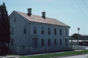 516-518 WATER ST, a Greek Revival boarding house, built in Sheboygan Falls, Wisconsin in 1837.