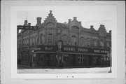 225-227 E MILL ST, a German Renaissance Revival retail building, built in Plymouth, Wisconsin in 1889.