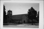 1125 N 6th St and 523 St Clair Ave, a Late Gothic Revival church, built in Sheboygan, Wisconsin in 1954.