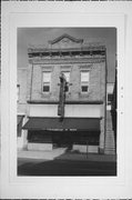 1103 N 8th St, a Queen Anne small retail building, built in Sheboygan, Wisconsin in 1884.