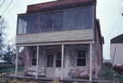 218 E MILL RD, a Boomtown blacksmith shop, built in Galesville, Wisconsin in 1871.