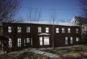 61-65 E WALWORTH AVE, a Greek Revival lodging-hotel, built in Delavan, Wisconsin in 1840.