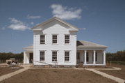 Old World Wisconsin Site (ORIGINAL LOCATION N SIDE OF COUNTY HIGHWAY O .2 M E OF BLUE WING RD), a Greek Revival house, built in Eagle, Wisconsin in 1857.
