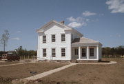 Old World Wisconsin Site (ORIGINAL LOCATION N SIDE OF COUNTY HIGHWAY O .2 M E OF BLUE WING RD), a Greek Revival house, built in Eagle, Wisconsin in 1857.