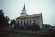 N SIDE OF TOWN LINE RD .1 M E OF CHAPEL DR, E SHORE OF WHITEWATER LAKE, a Greek Revival church, built in Whitewater, Wisconsin in 1855.