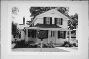 9 E ROCKWELL ST, a Greek Revival house, built in Elkhorn, Wisconsin in 1836.