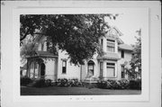 121 N WISCONSIN ST, a Queen Anne house, built in Elkhorn, Wisconsin in 1875.