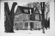 202 N MARTIN ST, a Dutch Colonial Revival house, built in Sharon, Wisconsin in 1900.