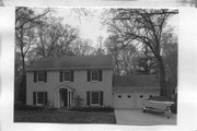 1506 WOOD LANE, a Colonial Revival/Georgian Revival house, built in Shorewood Hills, Wisconsin in 1937.