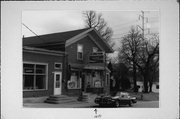 1805 BARTON AVE, a Front Gabled retail building, built in West Bend, Wisconsin in 1865.