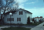 N89 W16840 Appleton Ave., a Greek Revival house, built in Menomonee Falls, Wisconsin in 1857.