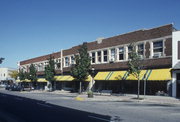 258-279 W BROADWAY AND 265-285 W MAIN ST, a Prairie School large retail building, built in Waukesha, Wisconsin in 1914.
