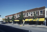 258-279 W BROADWAY AND 265-285 W MAIN ST, a Prairie School retail building, built in Waukesha, Wisconsin in 1914.