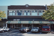 258-279 W BROADWAY AND 265-285 W MAIN ST, a Prairie School retail building, built in Waukesha, Wisconsin in 1914.