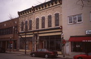 320-328 W BROADWAY AVE, a Italianate large retail building, built in Waukesha, Wisconsin in 1890.