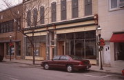 320-328 W BROADWAY AVE, a Italianate large retail building, built in Waukesha, Wisconsin in 1890.