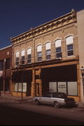 320-328 W BROADWAY AVE, a Italianate large retail building, built in Waukesha, Wisconsin in 1890.
