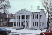 229 WISCONSIN AVE, a Greek Revival house, built in Waukesha, Wisconsin in 1842.