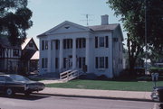 229 WISCONSIN AVE, a Greek Revival house, built in Waukesha, Wisconsin in 1842.