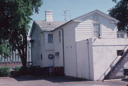 229 WISCONSIN AVE, a Greek Revival house, built in Waukesha, Wisconsin in 1842.