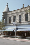 802 N GRAND AVE, a Queen Anne retail building, built in Waukesha, Wisconsin in 1891.