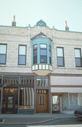 802 N GRAND AVE, a Queen Anne retail building, built in Waukesha, Wisconsin in 1891.