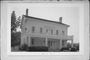 428 W WELLS ST, a Greek Revival inn, built in Delafield, Wisconsin in 1846.