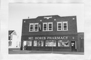 203 W MAIN ST, a Twentieth Century Commercial automobile showroom, built in Mount Horeb, Wisconsin in 1917.