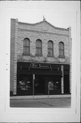 114 N MAIN ST, a Commercial Vernacular small retail building, built in Oconomowoc, Wisconsin in 1891.