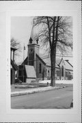 200 BLOCK OF S MAIN ST, a Late Gothic Revival church, built in Oconomowoc, Wisconsin in 1860.