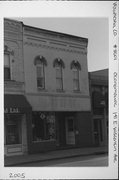 141 E WISCONSIN AVE, a Italianate small retail building, built in Oconomowoc, Wisconsin in 1884.