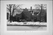 209-213 W WISCONSIN AVE, a English Revival Styles funeral home, built in Oconomowoc, Wisconsin in 1937.