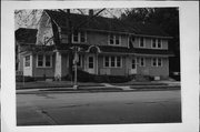 403-405 W WISCONSIN AVE, a Dutch Colonial Revival duplex/two-flat, built in Oconomowoc, Wisconsin in 1925.