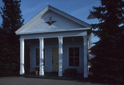 202 E UNION ST, a Greek Revival small office building, built in Waupaca, Wisconsin in 1853.