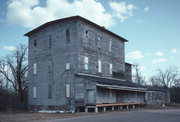213 S OBORN ST, a Astylistic Utilitarian Building mill, built in Waupaca, Wisconsin in 1884.