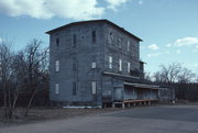 213 S OBORN ST, a Astylistic Utilitarian Building mill, built in Waupaca, Wisconsin in 1884.