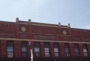 204-210 S MAIN ST, a Queen Anne large retail building, built in Waupaca, Wisconsin in 1884.