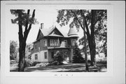 203 W BEACON AVE, a Queen Anne house, built in New London, Wisconsin in 1860.