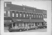 204-210 S MAIN ST, a Queen Anne large retail building, built in Waupaca, Wisconsin in 1884.